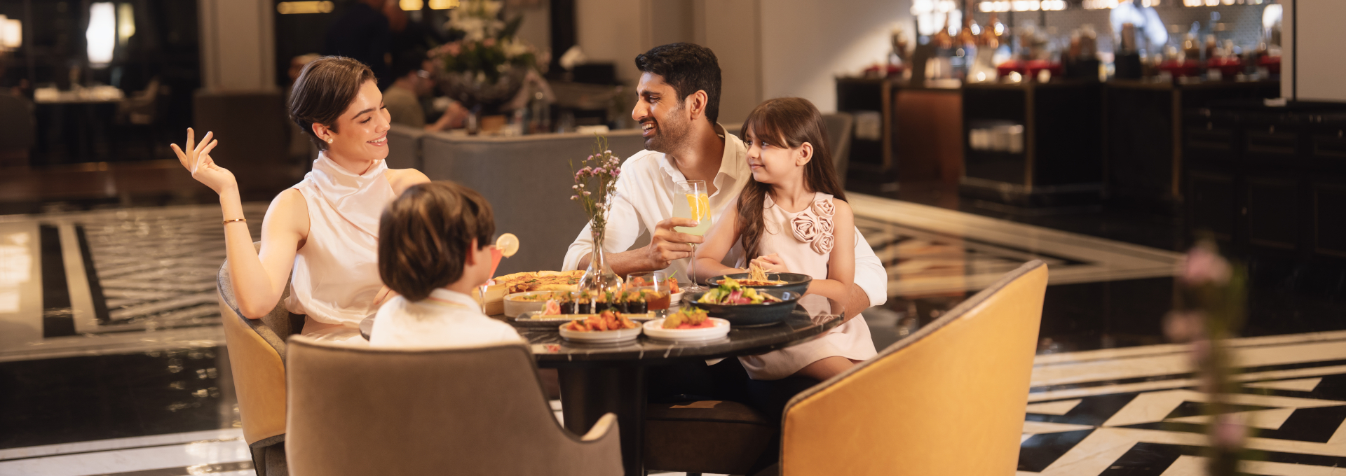 Family enjoying a meal at the Merchants Restaurant
